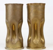 A pair of WWI brass shell case trench art vases, each of waisted fluted form with stipple