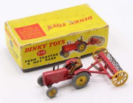 Dinky Toys box No. 310 farm tractor and hayrake, comprising Massey Harris tractor finished in red