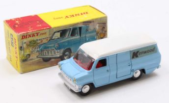 A Dinky Toys No. 407 Ford Transit van comprising of light blue body with white roof and red