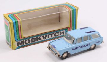 A Russian diecast 1/43rd scale model of a Moskvitch, light blue body, with a white interior, with '