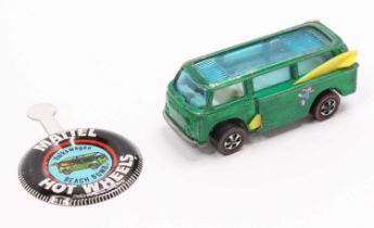 A Hot Wheels Redlines Beach Bomb Volkswagen Camper Van in emerald, with a white interior, comes with