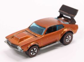 A Hot Wheels Redlines 'Mighty Maverick' in copper with a black interior & spoiler (VG)