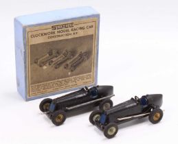 A Scamold Brooklands Motor Course clockwork model racing car kit containing two examples which