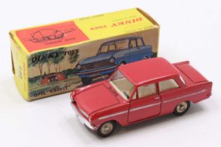 A Dinky Toys No. 540 Opal Kadett comprising red body, cream interior with flat spun hubs in the