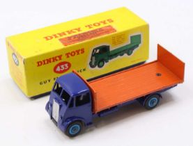 Dinky Toys No. 433 guy flat truck comprising of a dark blue cab and chassis with light blue hubs and