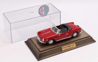 A Togi Toys of Italy 1/24th scale diecast model of an Alfa Romeo 1300 Spider, red body, with