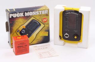 A Puck Monster Computer Games Ltd electronic game, housed in the original box, with a Universal type