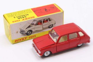 A French Dinky Toys No. 1416 Renault 6 saloon comprising of red body with cream interior, flat