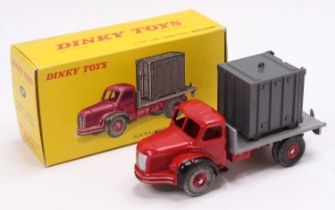 A French Dinky toys No. 581 Berliet container lorry comprising red cab and chassis with grey back,