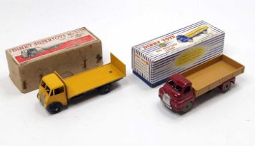 Dinky Toys boxed model group, 2 examples comprising No. 513 Guy Flat Truck with tailboard, yellow