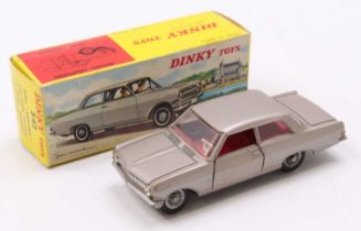 A Dinky Toys No. 542 Opal Rekord, comprising of light metallic grey body with red interior and