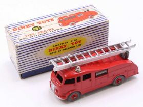 Dinky Toys No. 955 fire engine comprising red body with matching hubs and silver ladder in the