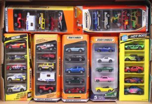 One tray containing a quantity of Matchbox modern release five packs to include Racing gift set,