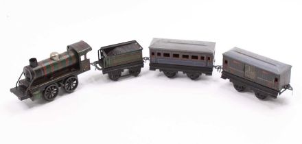 Kark Bub clockwork 0-4-0 loco & tender with one coach and a baggage car. Dark green with red lining.