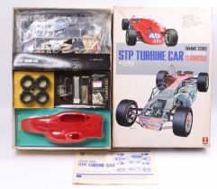 A Bandai No. 6040 1/12 scale plastic kit for an STP Turbine race car, as issued in the original card