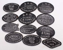 A collection of 12 cast iron makers plates, wagon plates and others, from various companies, and