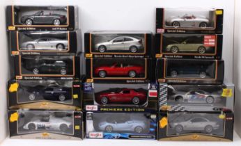 14 Maisto 1/18th scale diecasts, with examples including an Audi TT Roadster, a Mini Cooper, a