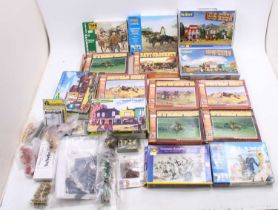 A collection of mixed scale wild west figures and kit buildings, with examples including a Kibri
