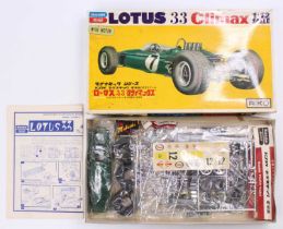 A Bandai 1/12th scale model kit of a Lotus 33 Climax, with components in their original sealed