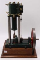 A large scale live steam vertical stationary engine, comprising of single large cylinder mounted