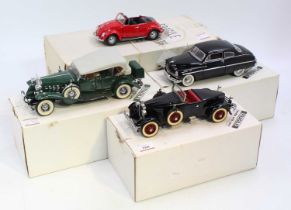 A collection of four various boxed Danbury Mint and Franklin Mint 1/24 scale diecast vehicles to