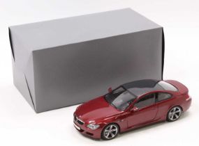 A Kyosho 1/18th scale BMW M6 in burgundy as issued in its original polystyrene packed box