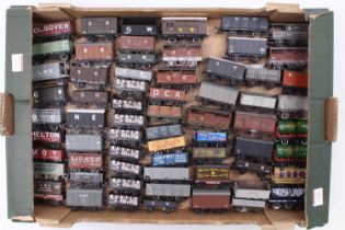 Large tray containing 65 unboxed 00-gauge goods wagons, some duplicates. Various makes & some kit