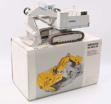 NZG No.357 1/50th scale diecast model of a Demag H485S Hydraulic Excavator, finished in white, in