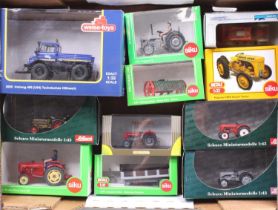 One tray containing a quantity of 1/32 and 1/43 scale agricultural and farm related diecast vehicles