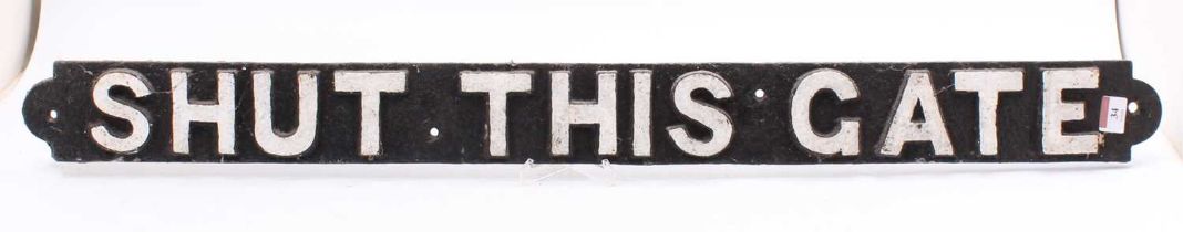 Cast iron "Shut this Gate" sign repainted in black. measures 39 inches long by 4. In good