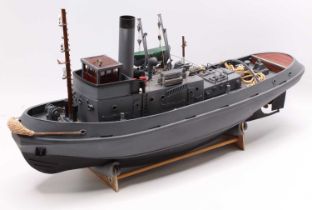 Gas Powered Kit Built and Later adapted model of a Military Tug Boat, finished in grey and black