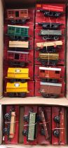 Seventeen Hornby 4-wheel post-war goods wagons, all boxed, in one large tray and one shoebox. Some