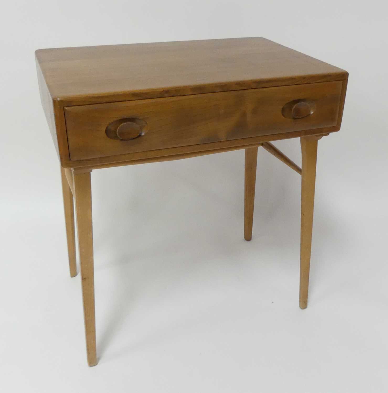 A 1960s Ercol blond elm Windsor 437 single drawer side table, raised on square slightly tapering