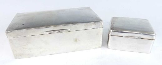 A large Art Deco silver clad table cigar box, the slightly domed hinged cover later inscribed,