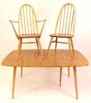 An Ercol blond elm dining suite, comprising; Grand Windsor 510 dining table with pull-out action,