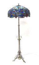 An Art Nouveau silvered brass three-branch standard lamp, having telescopic action, with Tiffany
