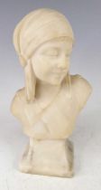 A French Art Deco carved alabaster head and shoulders bust, modelled as a young woman wearing a