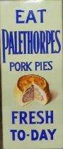 An early 20th century enamel on metal wall mounted advertising sign 'EAT PALETHORPES PORK PIES FRESH