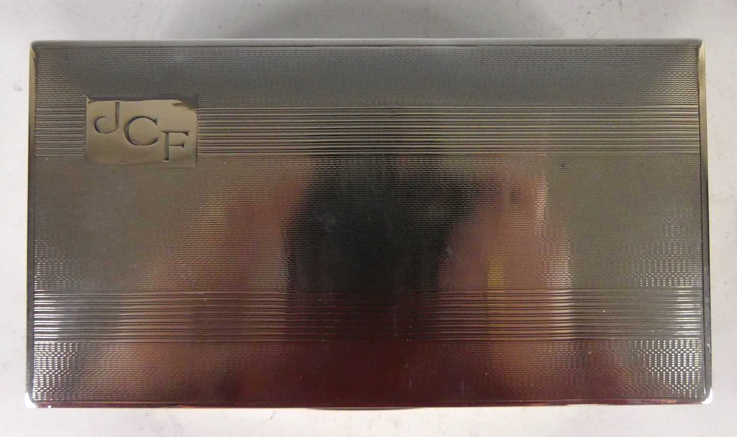 A late Art Deco silver table cigarette box, with engine turned hinged cover monogrammed 'JCF' to top - Image 2 of 3