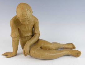 S.E. Nichols - a studio pottery model of a girl in recumbent pose, impressed signature to