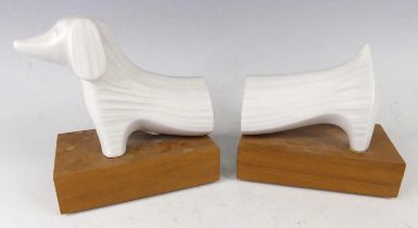 Jonathan Adler (b.1966) - a pair of ceramic sausage dog bookends, of stylised form and raised on