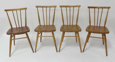 Two pairs of 1960s Ercol blond elm model 391 stickback kitchen chairs, raised on turned slightly