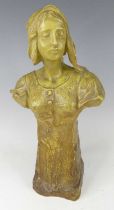 An Austrian Art Nouveau Goldscheider painted pottery female bust, looking to sinister and modelled