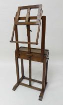 An Arts & Crafts oak freestanding artists easel by C. Roberson & Co, 99 Long Acre and 154