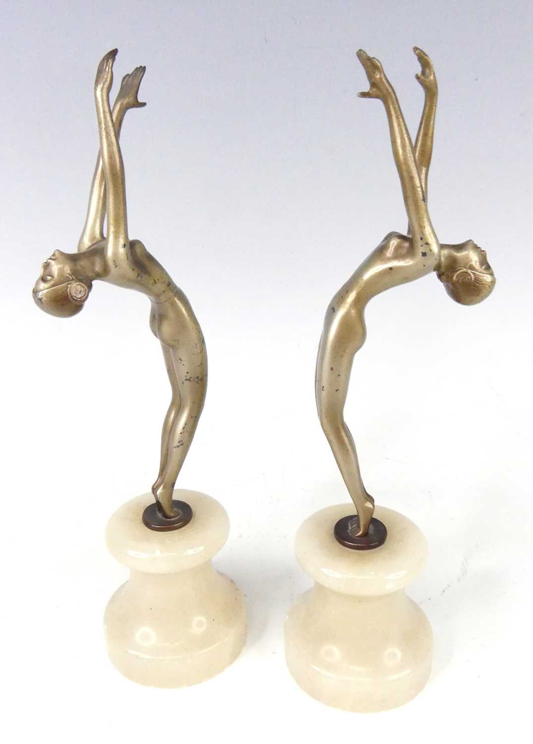 After Josef Lorenzl - a pair of 1930s patinated art metal nude model dancers, each standing on