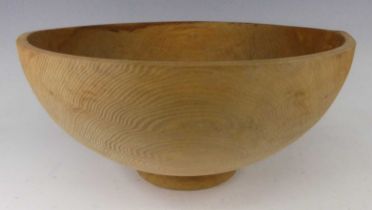 A large contemporary hand carved softwood footed table bowl, etched monogram to underside, dia.45.