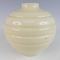 An early 20th century pottery vase by C.H. Brannam Ltd of Barnstaple, of bulbous concentric banded