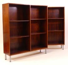 A pair of 1970s Danish rosewood freestanding open display shelves, each with twin flights of