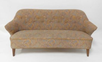 A 1960s Danish teak framed three-seater sofa, having floral needlework fabric reupholsterey with