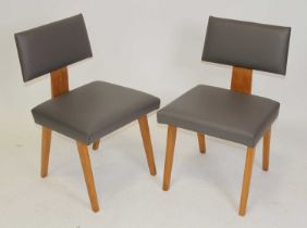 Attributed to Robin Day - a pair of 1960s waiting room chairs, layered plywood raised on beech